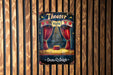 a theater sign hanging on a wooden wall