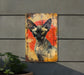 a painting of a cat on a wall next to a potted plant