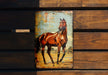 a picture of a horse on a wooden surface