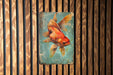 a painting of a goldfish on a wooden wall