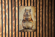a picture of a rodent on a wooden wall