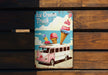 an ice cream truck sign on a wooden bench