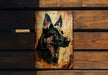 a picture of a german shepard on a wooden wall