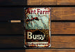 a rusted metal sign on a wooden wall