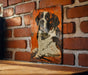 a picture of a dog on a brick wall