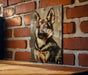 a picture of a dog is hanging on a brick wall