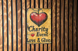 a sign that says charity event love and give