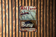 a rusted metal sign on a wooden wall