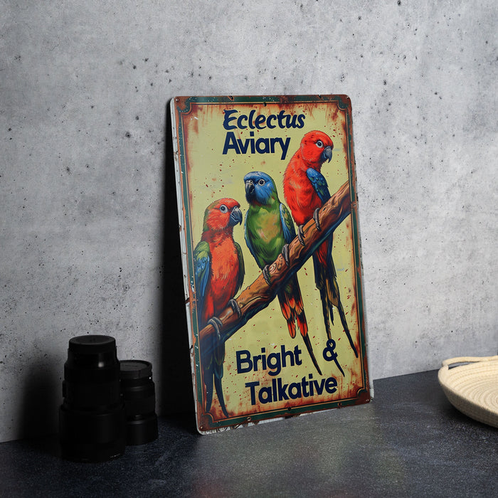 a metal sign with three parrots sitting on a branch