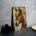 a painting of a horse on a wall next to a plate