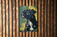 a painting of a dog on a wooden wall