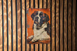 a picture of a dog on a wooden wall
