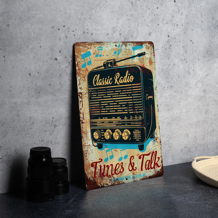 an old radio sits on a table next to a pair of binoculars