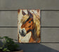a picture of a horse on a wall