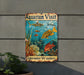 a sign on the side of a building that says aquarium visit underwater wonders