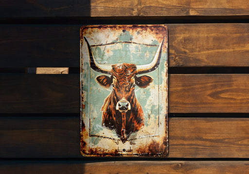 a rusted metal sign with a cow's head on it