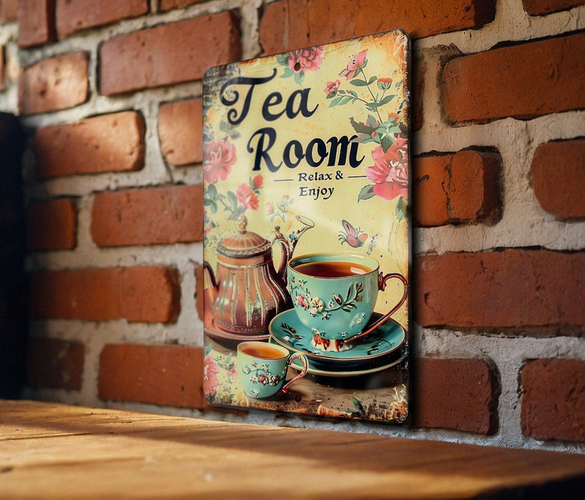 a picture of a tea room sign on a brick wall