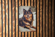 a picture of a dog on a wooden wall