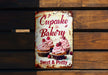 a sign that says cupcake bakery on it