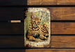a picture of a cat sitting on top of a wooden bench