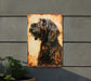 a painting of a dog on a rusted metal sign