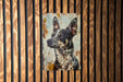 a painting of a dog on a wooden wall