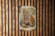 a picture of a cat on a wooden wall