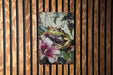 a picture of a frog on a wooden wall