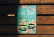 a tea book sitting on top of a wooden bench