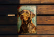 a picture of a dog on a wooden wall