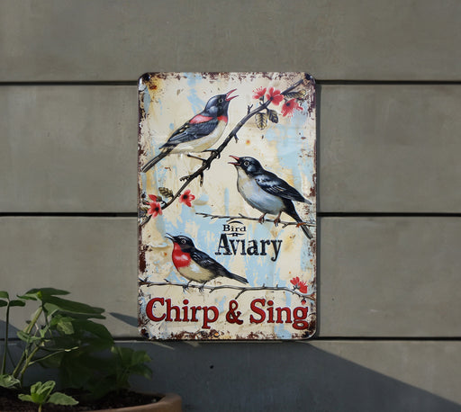 a sign on the side of a building with birds on it