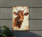 a picture of a cow on a wall