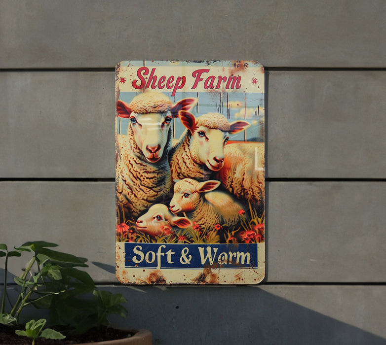 a sheep farm sign hanging on the side of a building