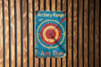 a wooden wall with a sign that says archery range aim true