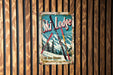 a ski lodge sign hanging on a wooden wall