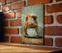 a picture of a dog in a cup on a brick wall
