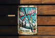 a ski lodge sign hanging on a wooden wall