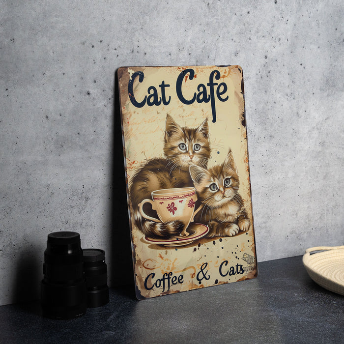 a picture of two cats sitting in a coffee cup