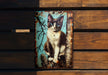 a picture of a cat sitting on a wooden bench