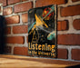 a sign on a brick wall that says listening to the universe