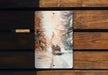 a wooden bench with a picture of two people in a sleigh