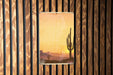 a picture of a cactus on a wooden wall