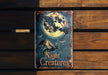 a metal sign that says night creatures on it