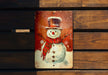 a picture of a snowman on a wooden bench