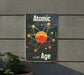 a sign on the side of a building that says atomic age