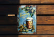 a metal sign with a mug of beer on it
