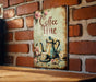 a picture of a coffee time sign on a brick wall