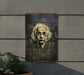 a painting of a man's face on the side of a building