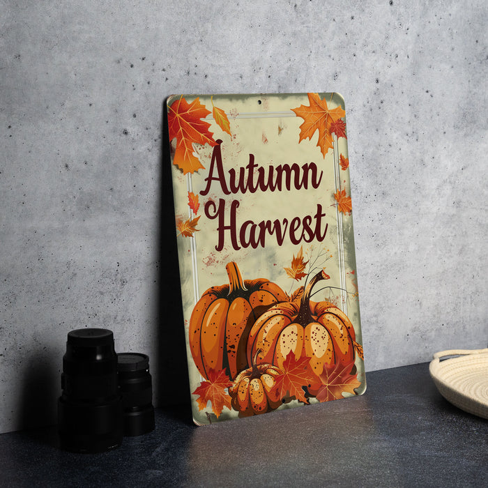 a metal sign that says autumn harvest on it
