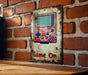 a game on sign on a brick wall